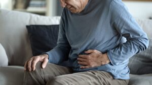 Man dealing with stomach pain