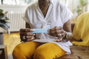 Patient taking pills for chronic pain treatment