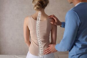 Patient who has curved spine and needs spine treatment
