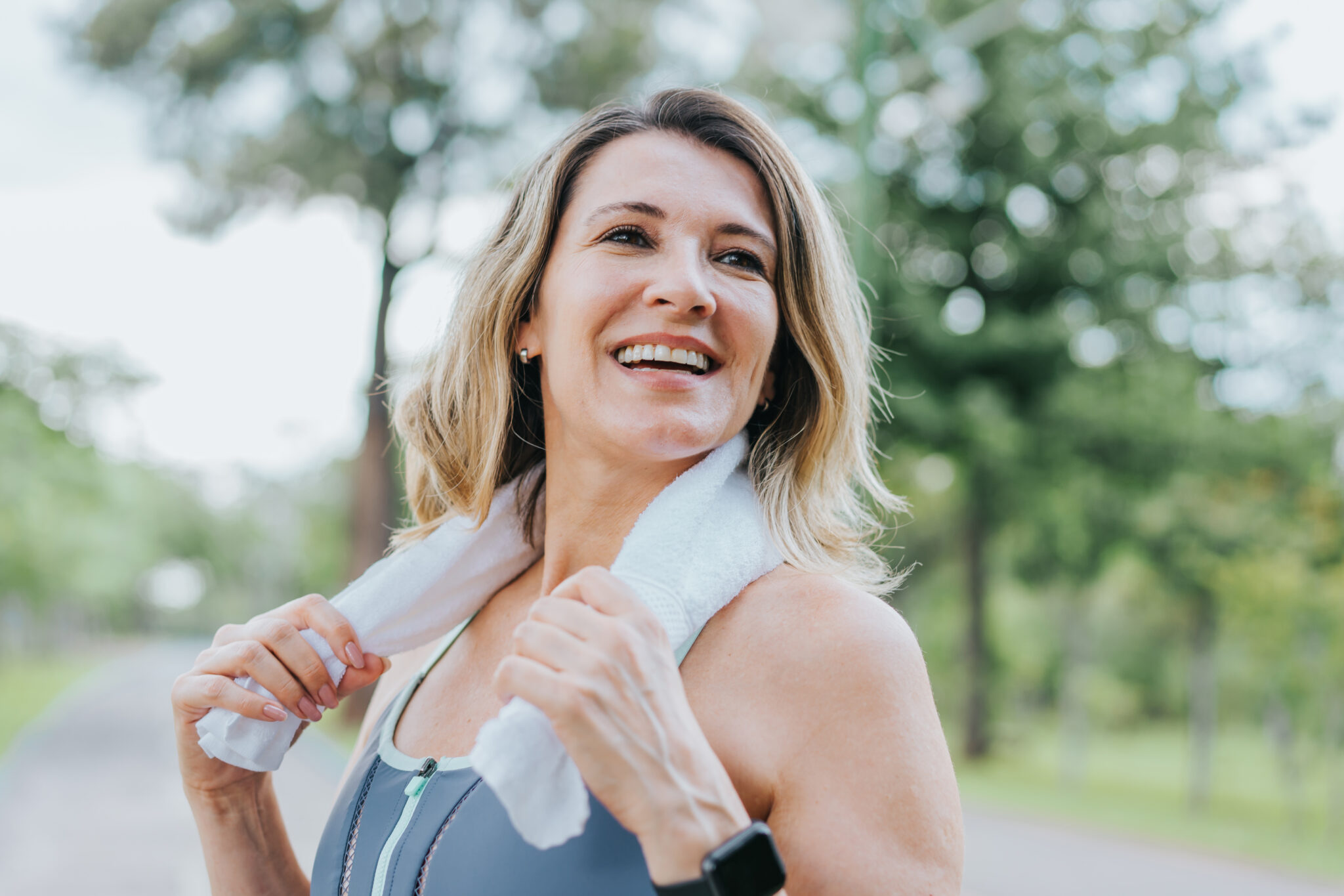 athletic woman finishing a workout and feeling happy and healthy